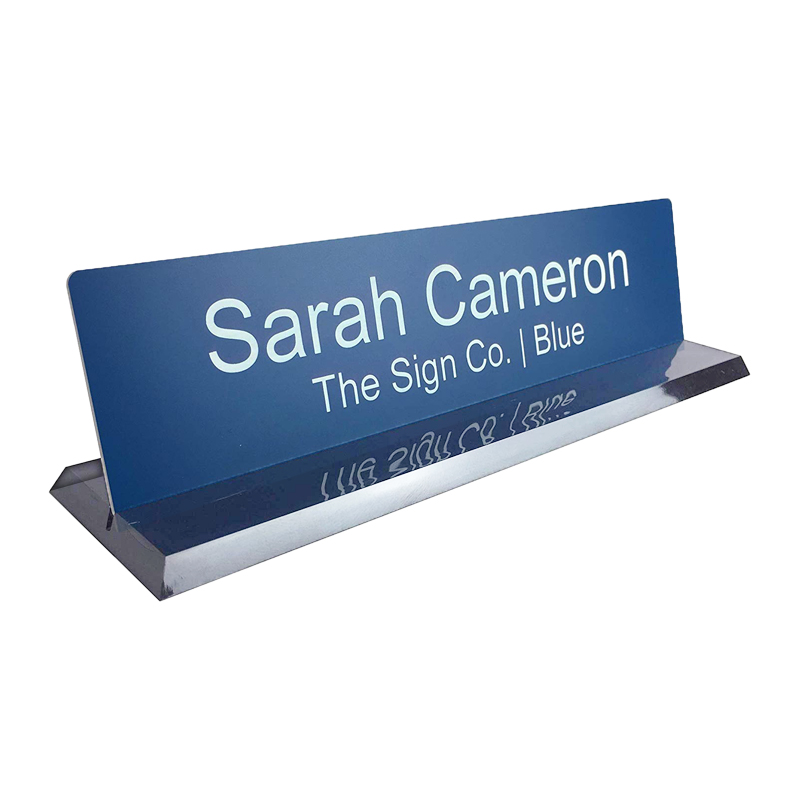 Customize this 2 x 10 desk sign with up to 2 lines of text or artwork. Available in 26 color combinations. Clear base included. Orders over $75 ship free!