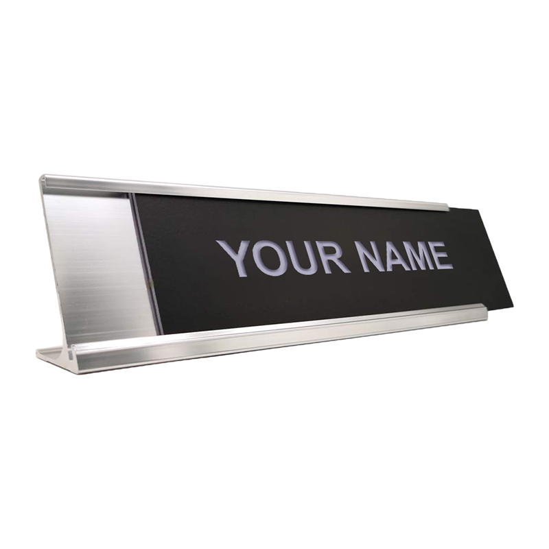 Customize this 2 x 10 desk sign with up to 2 lines of engraved text or artwork. Silver desk holder included - choice of 26 colors. Orders over $75 ship free!